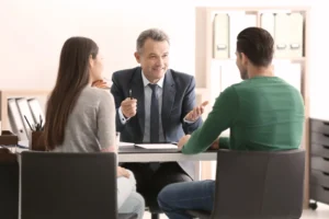 An attorney meeting with a couple.