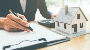 Someone signing documents for property.