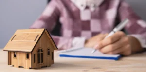 Young adult organizing finances and documents for estate planning.