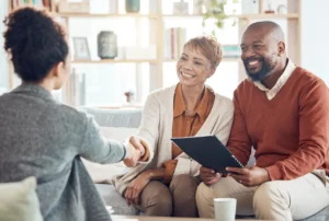 Couple and attorney, discussing the importance of having a will.